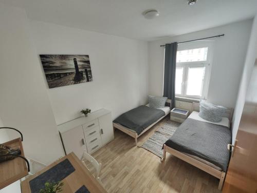 a living room with two beds and a window at Revant West 2 in Arnstadt