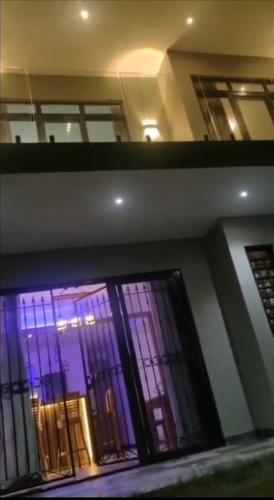 a view of a building with windows with purple lights at Ko Villa in Rivière du Rempart