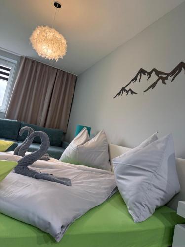 a bedroom with a bed with a snake on it at Modern Oasis in Nová Lesná