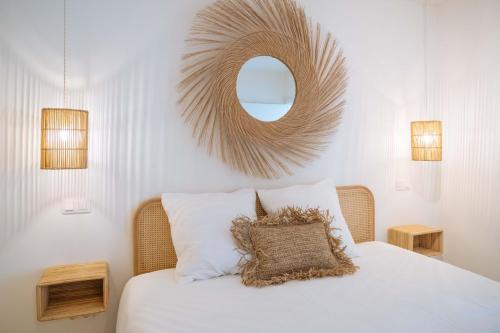 a bedroom with a bed with a mirror on the wall at Sweet Coffee Stay Apartments in Hasselt