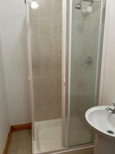 a bathroom with a shower and a sink at Fanore Apartment 3 in Fanore