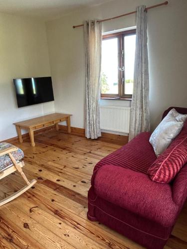 a living room with a couch and a table at Fanore Apartment 3 in Fanore