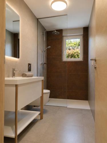 a bathroom with a sink and a shower at Visum Residence Labin - Luxury sea view retreat in Labin