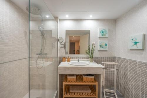 a bathroom with a sink and a shower at Alcaidesa Golf in La Alcaidesa