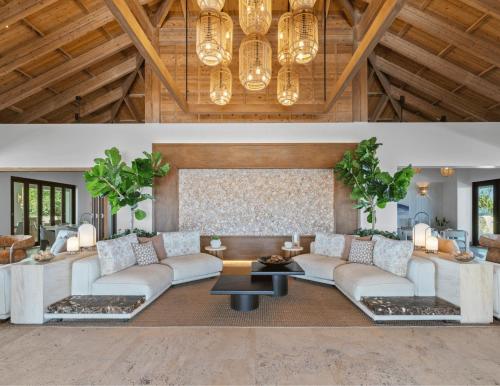 a living room with a couch and a table at Sailrock South Caicos, Small Luxury Hotels of the World in South Caicos