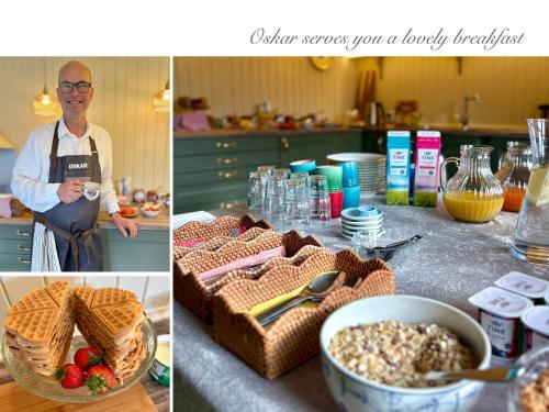 a man standing in a kitchen with a table with food at Villa Solvorn in Solvorn