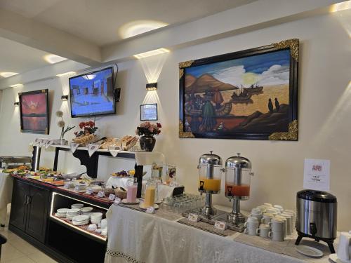 a bakery with a buffet of food on a table at TerraMistica Puno Centro in Puno