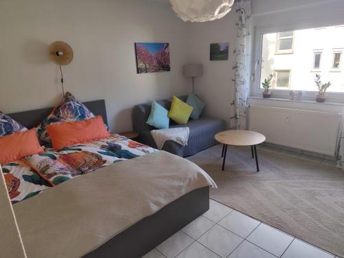 a bedroom with a bed and a couch at Little Castle in Bad Kreuznach