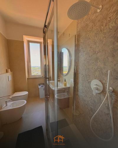 a bathroom with a shower and a toilet and a sink at La Cameranense by Homes in Ancona in Camerano