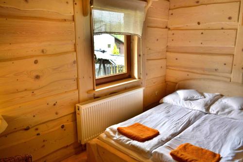 Giường trong phòng chung tại Alpejskie Domy Ski House