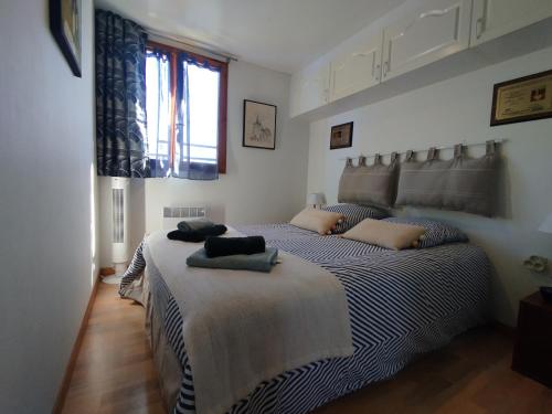 a bedroom with two beds with towels on them at Soucado in Fréjus