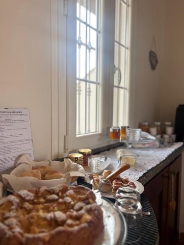 a table topped with plates of food on a counter at Il Sogno di Tebà in Fubine