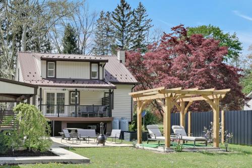 a house with a patio and a gazebo at Cozy Home Retreat by the River in Cressona