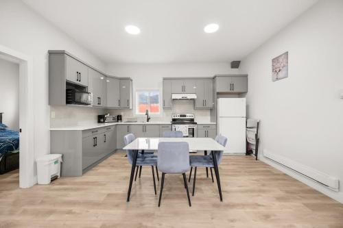 a kitchen and dining room with a table and chairs at Private Farm Escape with Modern Comforts in Abbotsford