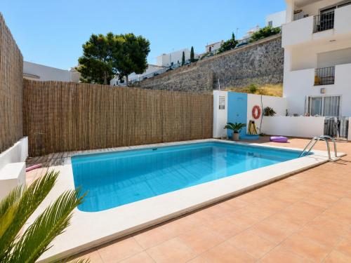 a swimming pool in the backyard of a villa at Penthouse with Sea and Mountain view by NRAS in Altea