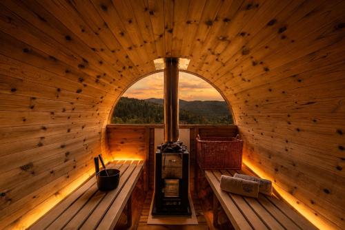 an inside of a wooden sauna with a window at Apartamenty Pod Horodkiem in Cisna
