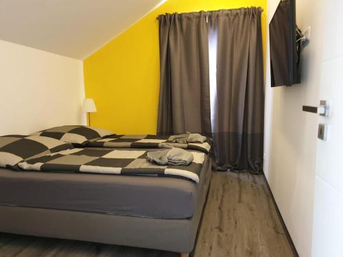 a bedroom with a bed and a window at Haus Strandoase Nr 4 in Oldenburg in Holstein