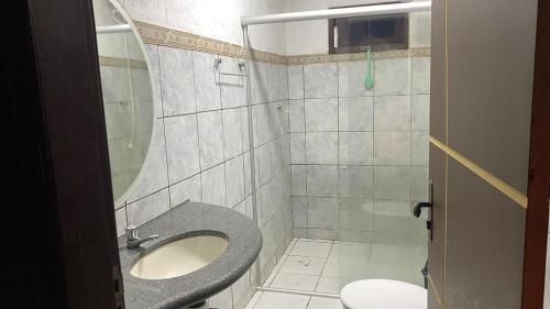 a bathroom with a toilet and a sink at Casa in Petrolina