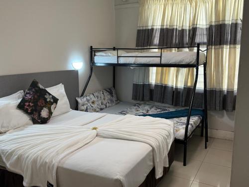 a bedroom with two bunk beds and a bed at JH Guest house in Durban