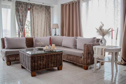 a living room with a couch and a table at Christina's Home in Skiathos