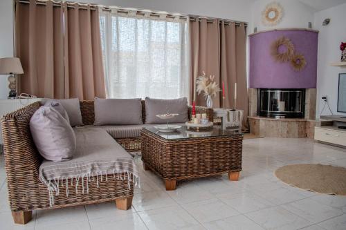 a living room with a couch and a table at Christina's Home in Skiathos