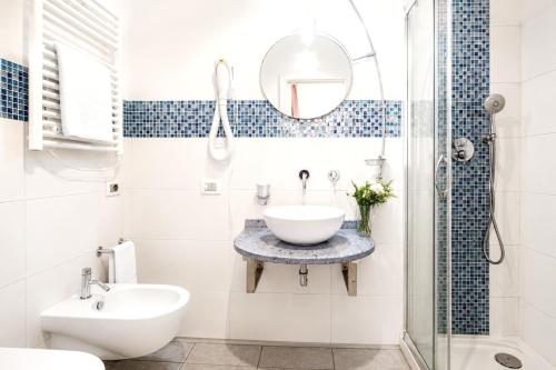 a bathroom with a sink and a mirror at Villa Maria Luisa in Cagliari