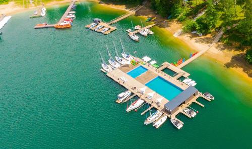 an aerial view of a marina with boats in the water at Solina Houseboat Polańczyk in Polańczyk