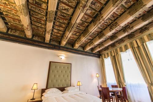 Postel nebo postele na pokoji v ubytování Residence Thunovska