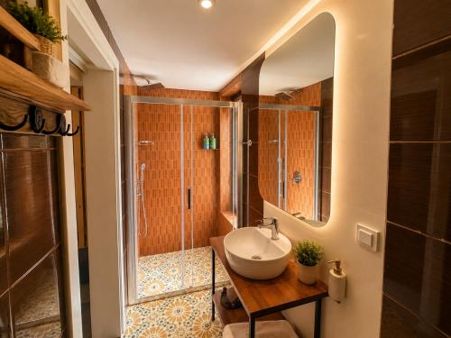 a bathroom with a sink and a shower at The One Alacatı in Çeşme