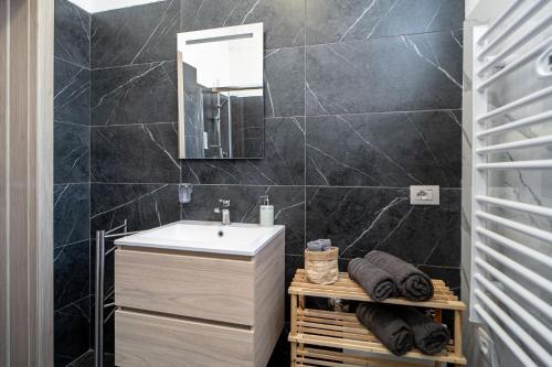 a bathroom with a sink and a mirror at La Porta Verde 8 - Relax vicino Parma in Collecchio