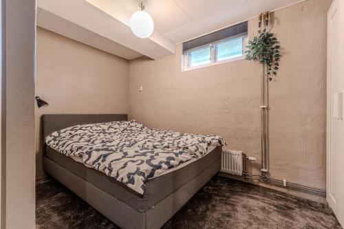 a bedroom with a bed and a shower at Newly built souterrain apartment in Älvsbacka in Skellefteå