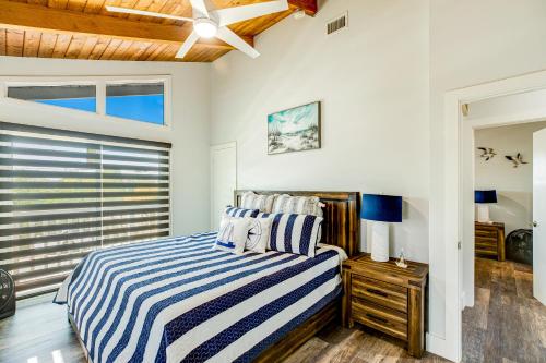 a bedroom with a bed and a window at BP05FLR Tradewinds Treat in Big Pine Key