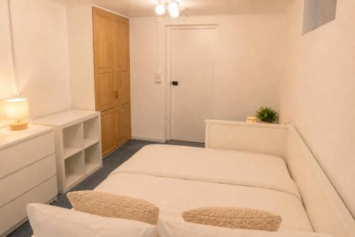 a room with two beds and a closet at Boende i Vimmerby in Vimmerby