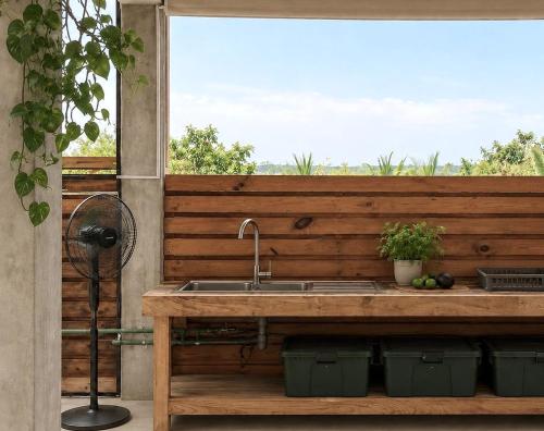 a kitchen counter with a sink and a window at Casa Chukum - Retreat House - Agua Blanca in Playa Agua Blanca