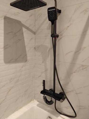 a shower in a bathroom with a shower head at Villa Marmara in Medina