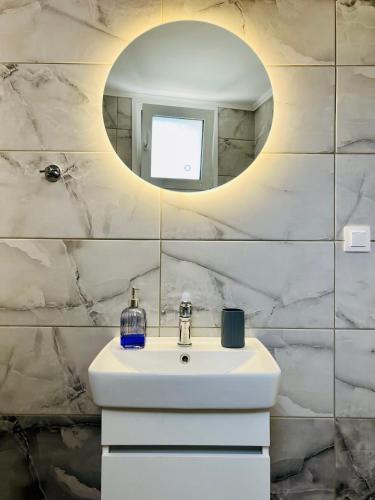 a bathroom with a sink and a mirror at Serenity in Petra