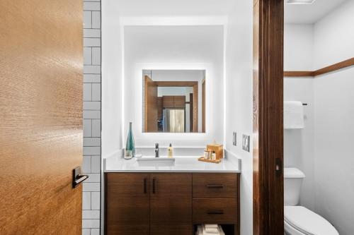 a bathroom with a sink and a mirror at Juniper Preserve in Redmond