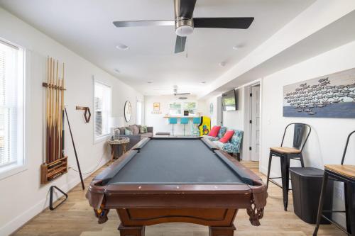 a living room with a pool table in it at This Home Has It All Location Amenities & More in Duck