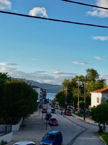a city street with cars parked on the road at Asul Seaside Retreat in Stavros