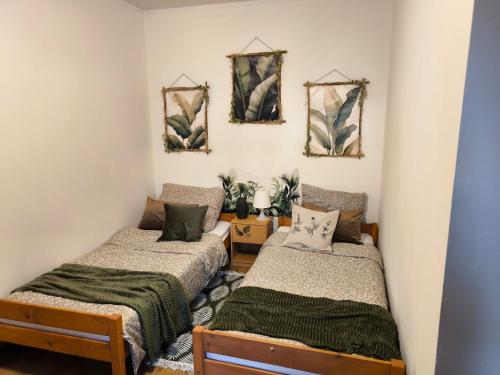 a room with two beds in a room at Agroturystyka Kuźnia in Neple