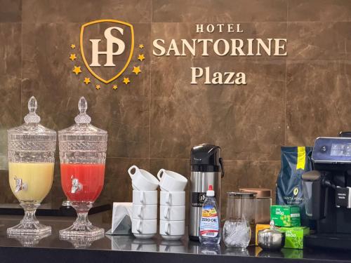 a counter top with a blender and a drink at Hotel Santorine Plaza - Itabira - Próximo a Fundação Cultural Carlos Drummond Andrade in Itabira
