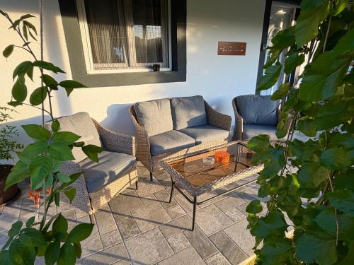 a living room with two couches and a coffee table at Sunlight Cottage Maya in Virpazar