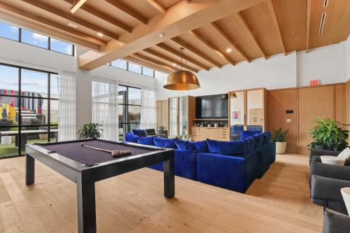 a living room with a ping pong table at Sentral West Midtown at Star Metals in Atlanta