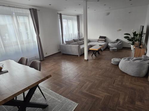 a living room with a couch and a table at Post 25 in Slezská Ostrava