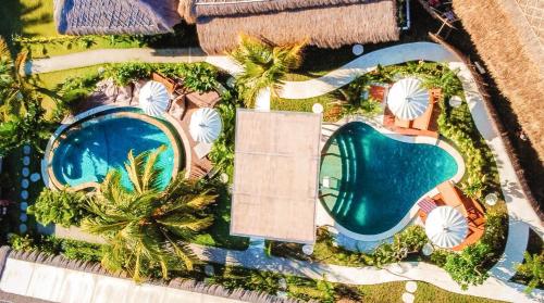 an overhead view of a resort with a swimming pool at Luana Lombok in Selong Belanak