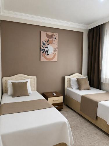 a hotel room with two beds in a room at Lale Residence in Trabzon