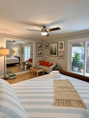 a bedroom with a bed and a living room at Northern Stay in North Vancouver