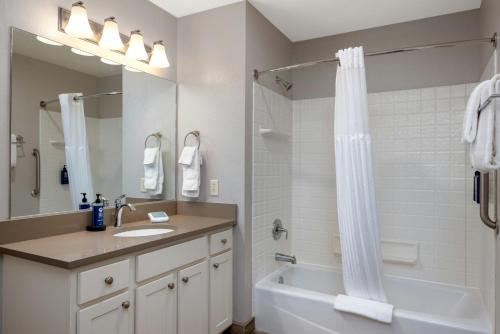 a bathroom with a tub and a sink and a shower at WorldMark Birch Bay in Birch Bay