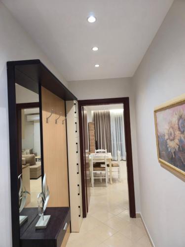 a dressing room with a desk and a mirror at A&B Seaside Residence in Golem