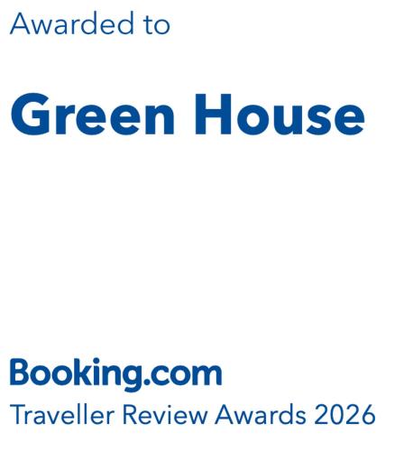 a sign for a green house with the words green house at Green House in St. John's